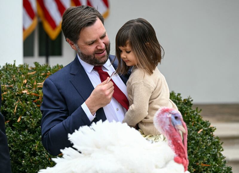 JD US Vice President JD Vance holds his daughter Mirabel after US President Donald Trump pardoned Gobble, one of the National Thanksgiving turkeys.