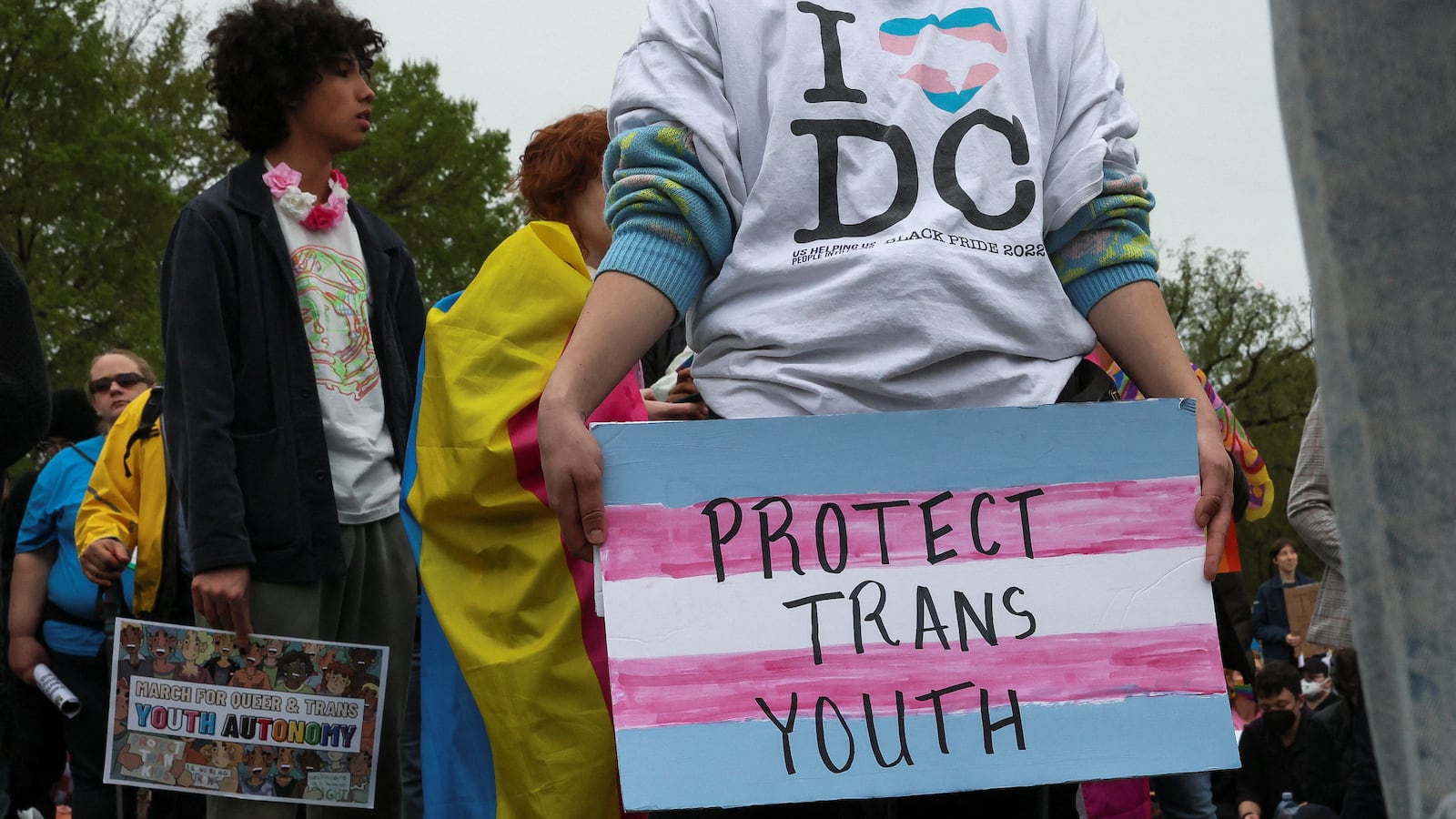 A person holds a sign during a \"March for Queer & Trans Youth Autonomy\" in Washington, D.C.