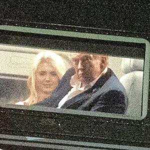 SEPTEMBER 13: U.S. President Donald Trump and Executive Assistant to the President Natalie Harp return to the White House aboard Marine One on September 13, 2025 in Washington, DC. President Trump is returning after spending the weekend in Ireland where he met with leaders and attended the 2026 Amgen Irish Open at his Trump International Golf Links and Hotel.