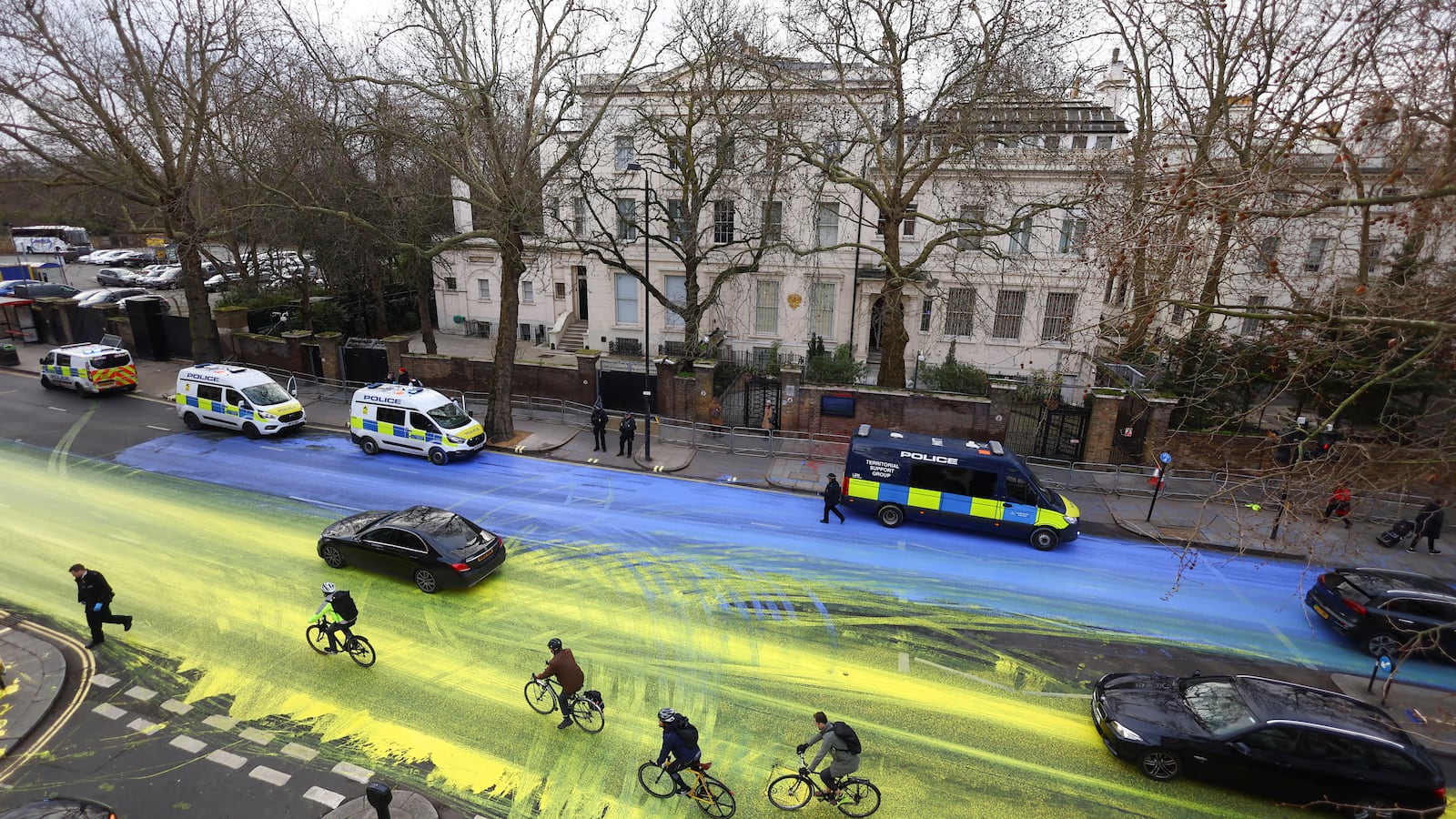 Protest group 'Led by Donkeys' spread paint in the colors of the Ukrainian flag on the road, ahead of the first anniversary of Russia's invasion of Ukraine, outside the Russian Embassy in London, Britain February 23, 2023.