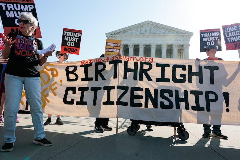 Demonstrators rally in support of birthright citizenship outside the US Supreme Court as President Donald Trump attends oral arguments in Washington, DC on April 1, 2026. President Donald Trump is watching in person as the US Supreme Court hears a landmark case weighing the constitutionality of his contentious bid to end birthright citizenship, an extraordinary and possibly unprecedented move for the nation's highest office.