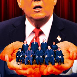 A photo illustration of President Donald Trump holding the Supreme Court Justices in the palm of his hands.