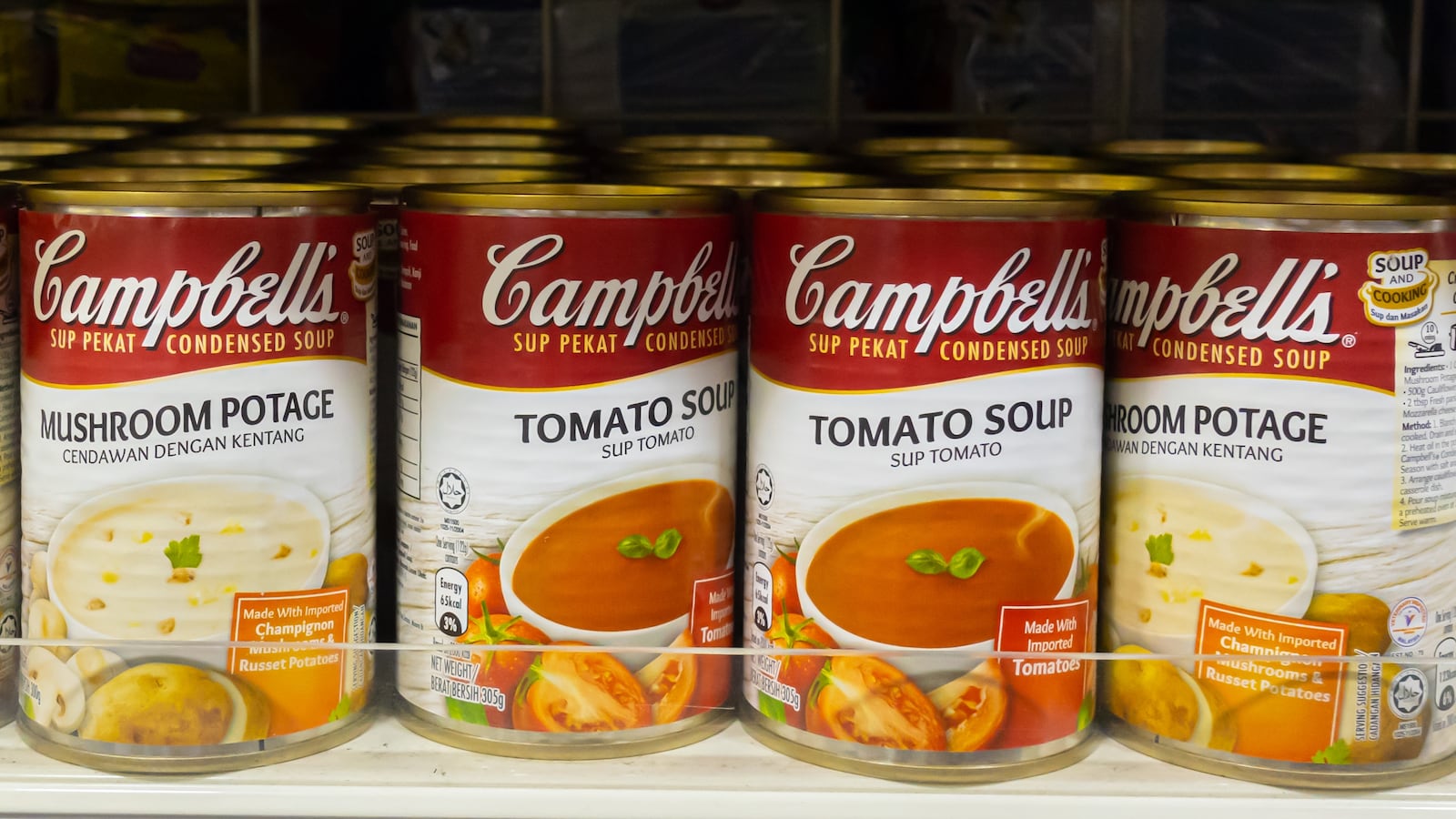 KK Mart Kuala Lumpur, Malaysia, shelf display of Campbell's soup cans in a grocery store.