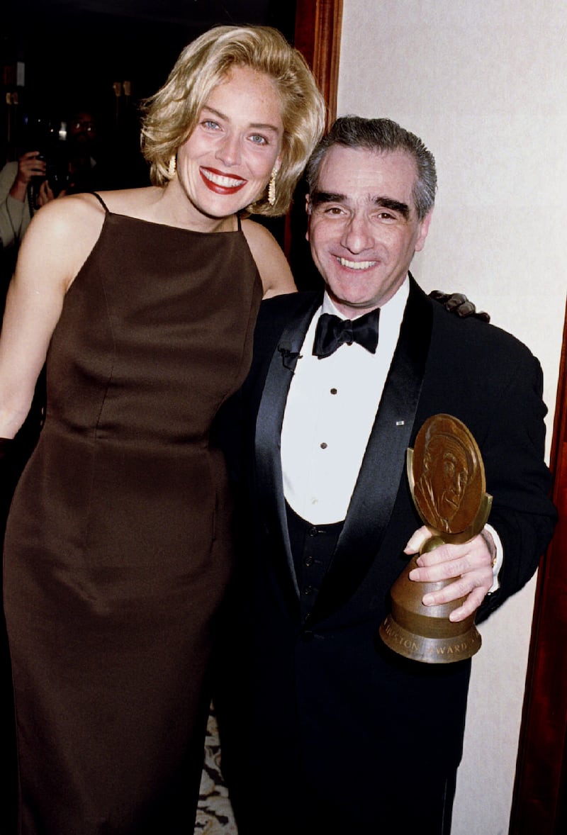 Film director Martin Scorsese holds the John Huston Award for Artists Rights he received from the Artists Rights Foundation as he poses with actress Sharon Stone February 16 at the awards dinner. Stone recently received a best actress Academy Award nomination for her role in Scorsese's film "Casino