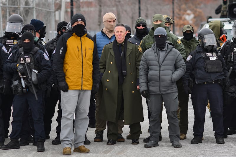 U.S. Customs and Border Protection Commander Gregory Bovino stands with his masked agents in Minnesota. He has since been sidelined by the administration.
