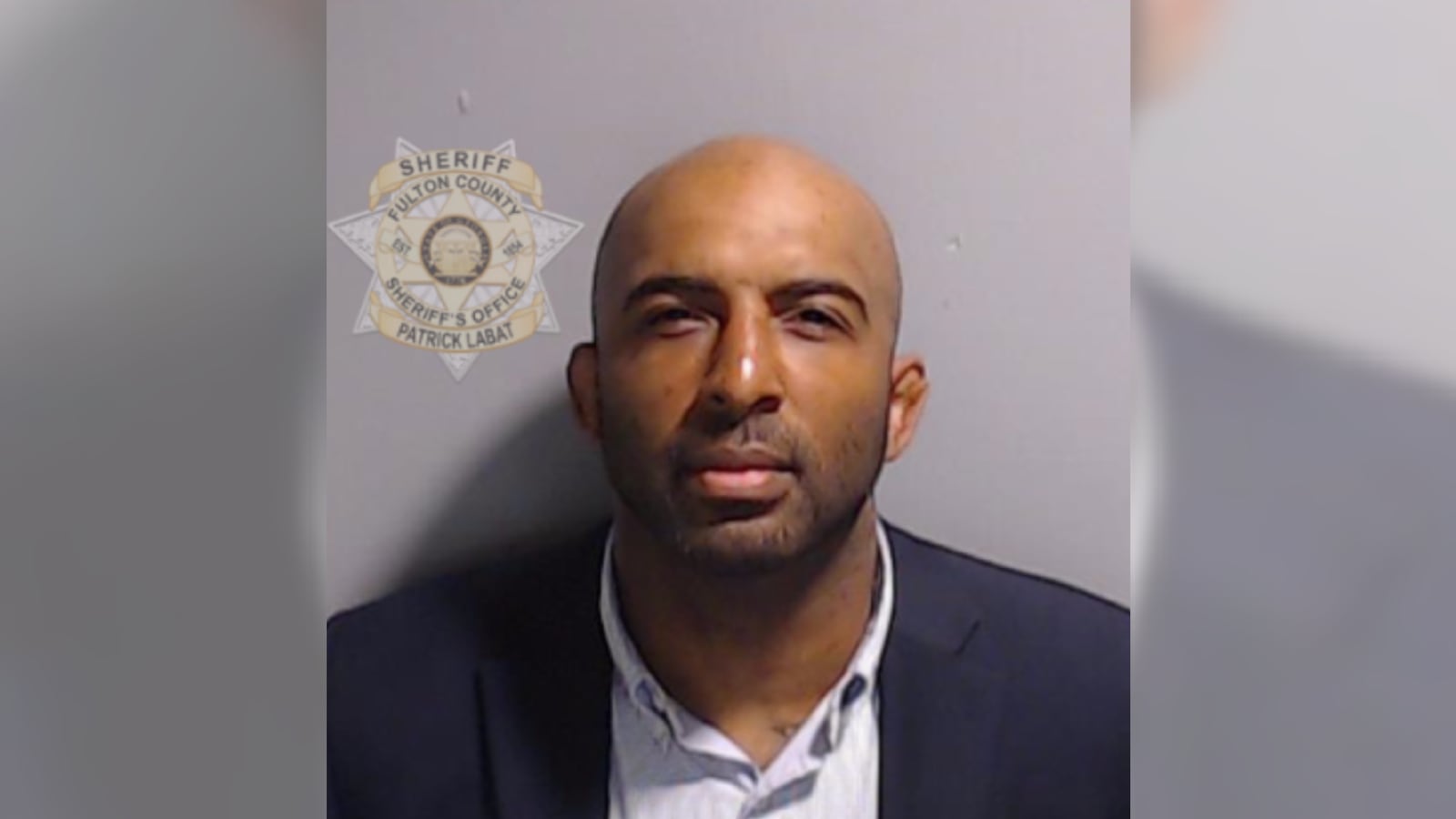 A mugshot of Harrison Floyd, with him staring forward and not smiling.