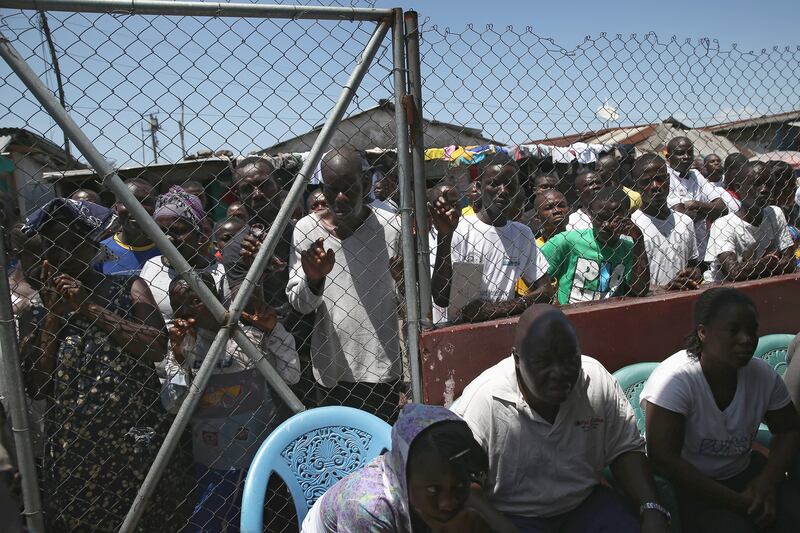 galleries/2014/10/23/portrait-of-an-epidemic-the-front-lines-of-ebola/141022-john-moore-ebola-05_xtlevv