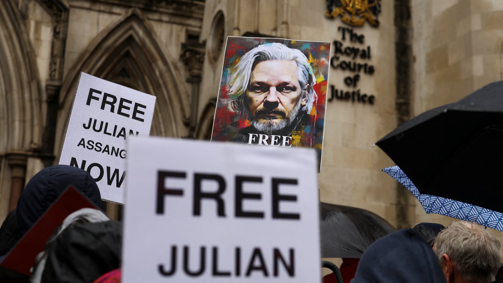 Supporters for Julian Assange rally outside a British courthouse.