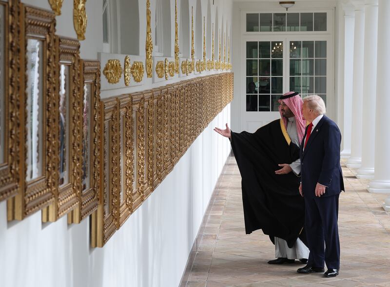 WASHINGTON, DC - NOVEMBER 18: U.S. President Donald Trump (R) shows Crown Prince and Prime Minister Mohammed bin Salman of Saudi Arabia the "Presidential Walk of Fame" as they walk on the colonnade at the White House on November 18, 2025 in Washington, DC. Trump is hosting the crown prince for meetings aimed at strengthening economic and defense ties, including the U.S. sale of F-35 fighter jets to Saudi Arabia. (Photo by Win McNamee/Getty Images)