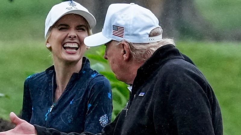 Donald Trump and Natalie Harp share a BIG laugh on the links earlier this year.