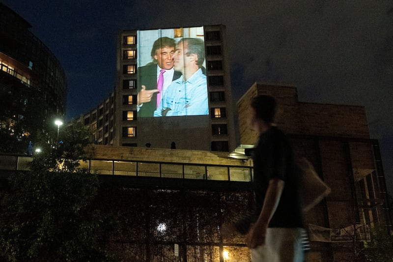 A photo of late financier and convicted sex offender Jeffrey Epstein and U.S. President Donald Trump is projected onto the Washington Hilton in Washington, D.C., U.S., April 24, 2026. REUTERS/Aaron Schwartz