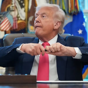 Donald Trump uncapping pen.