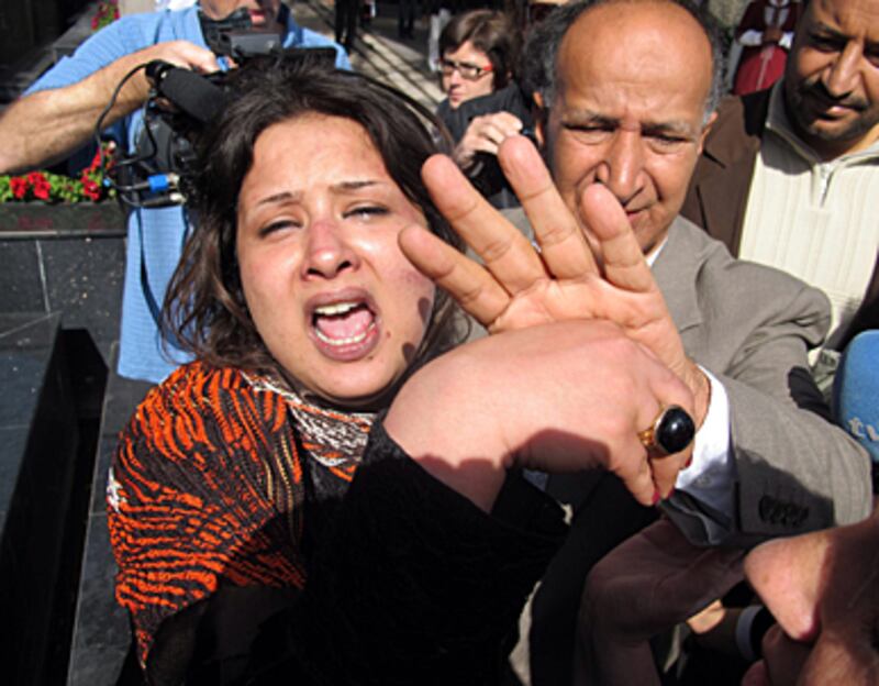 articles/2011/03/30/emad-al-obeidi-sued-for-being-raped-in-libya/griswold-eman-rape_170170_dtxtub