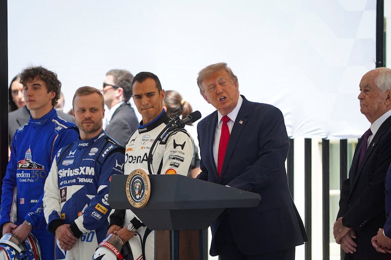 U.S. President Donald Trump speaks, next to IndyCar series drivers David Malukas, Felix Rosenqvist, and Alex Palou, and IndyCar series owner Roger Penske, during a Freedom 250 Grand Prix Showcase at the White House in Washington, D.C., U.S., July 13, 2026. REUTERS/Al Drago