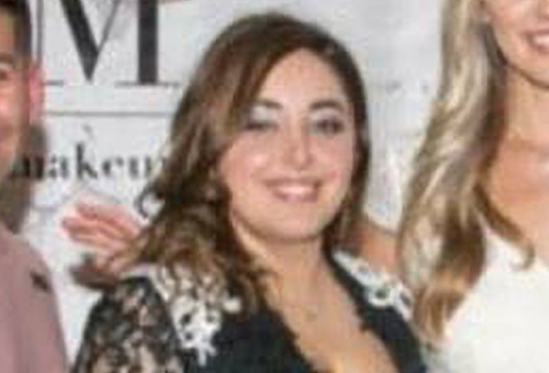 Mora Namdar, center, photographed with her beauty salon team in 2017.