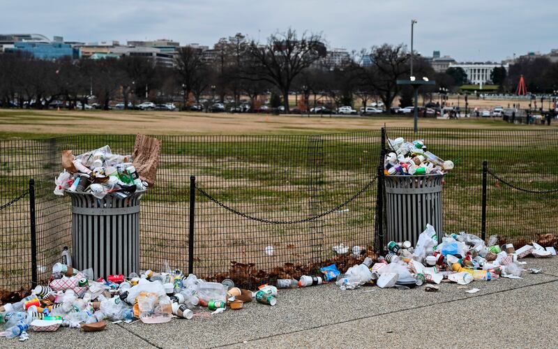 The White House is seen in the background, as trash lays uncollected on the National Mall due to the partial shutdown of the US government on January 2, 2019