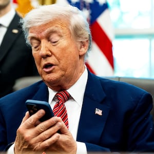 President Donald Trump, pictured silencing his cellphone in the Oval Office on May 23, has long been known for picking up the phone and making calls to reporters to get his side of a story out.