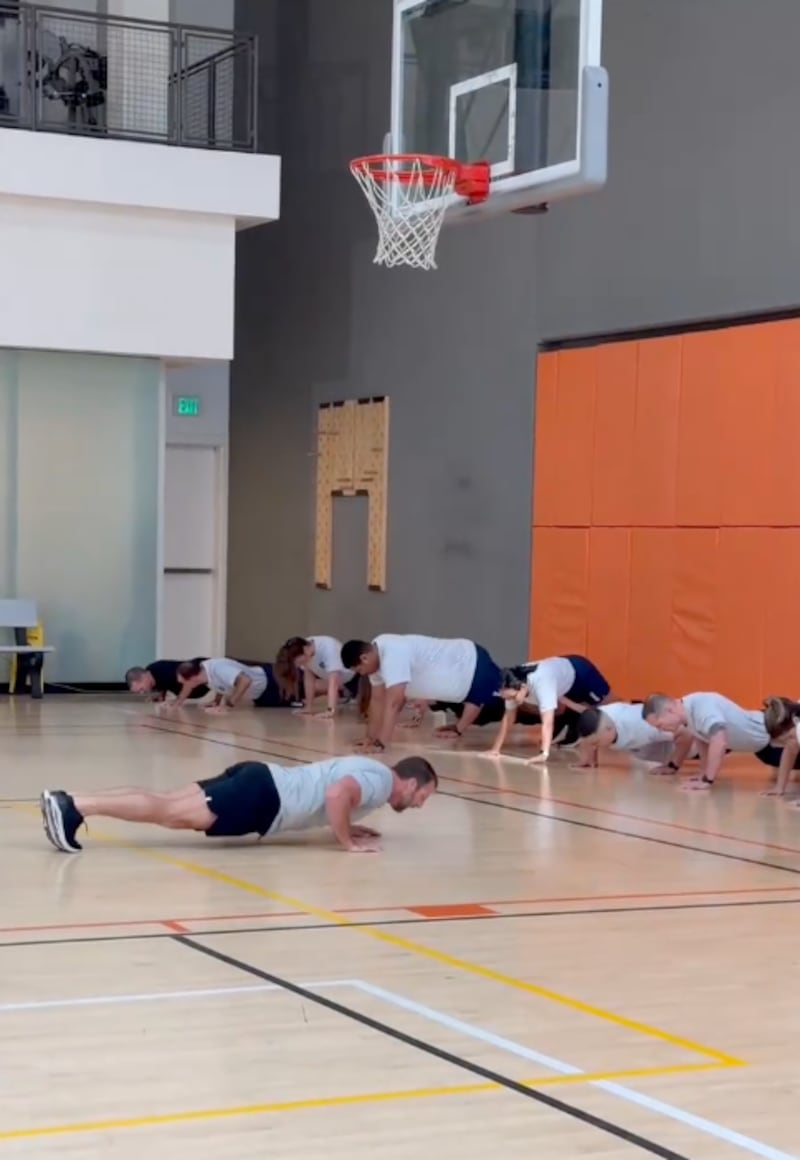 Secretary Markwayne Mullin, left, led the workout on Thursday.