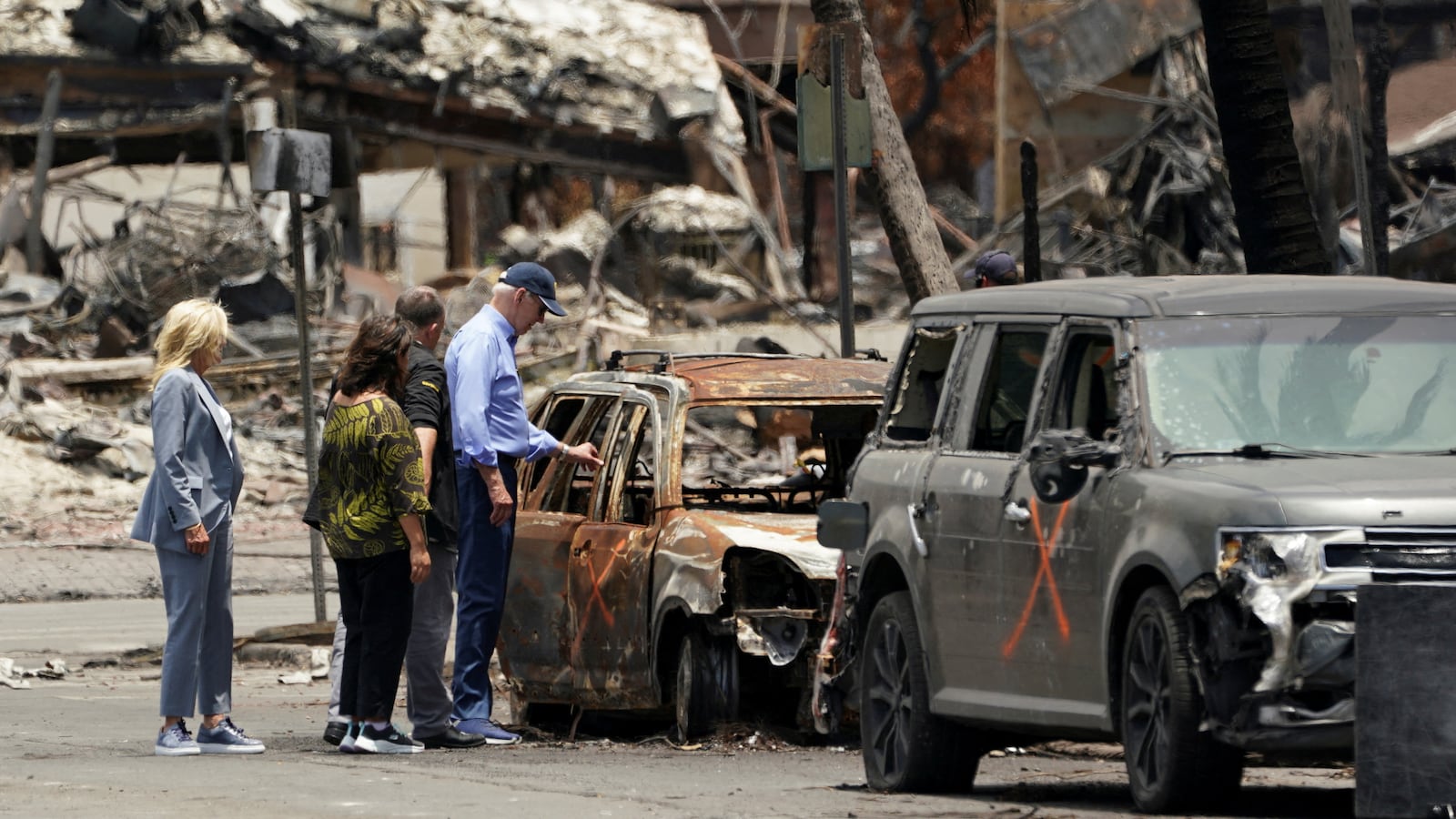 U.S. President Joe Biden and first lady Jill Biden accompanied by Hawaii Governor Josh Green and Jaime Green, First Lady of Hawaii, visit the fire-ravaged town of Lahaina on the island of Maui in Hawaii, U.S., August 21, 2023.