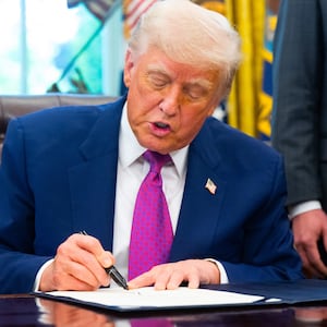 Donald Trump signs on legislation relating to household consumer energy policies, in the Oval Office of the White House in Washington, DC, on May 9, 2025.