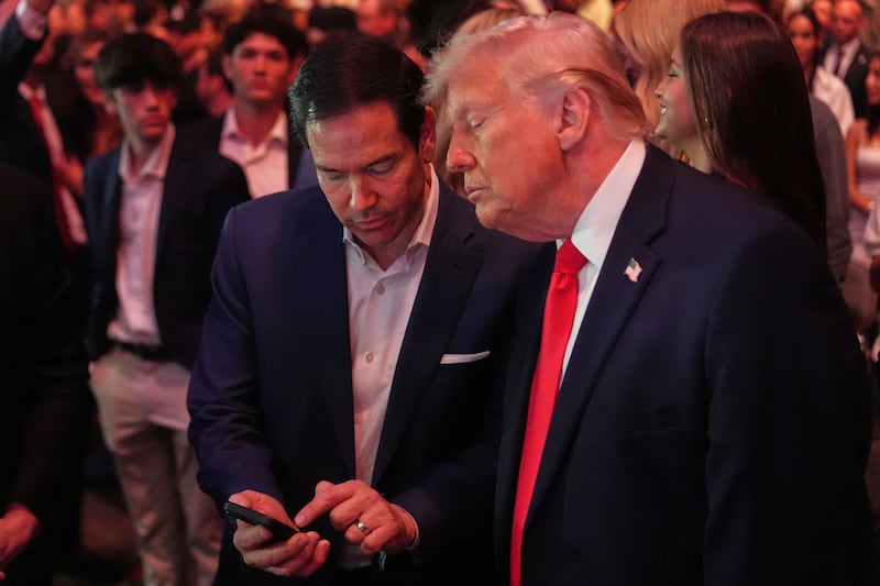 U.S. President Donald Trump talks with U.S. Secretary of State Marco Rubio while attending UFC 327 at Kaseya Center in Miami, Florida, U.S., April 11, 2026. Julia Demaree Nikhinson/Pool via REUTERS