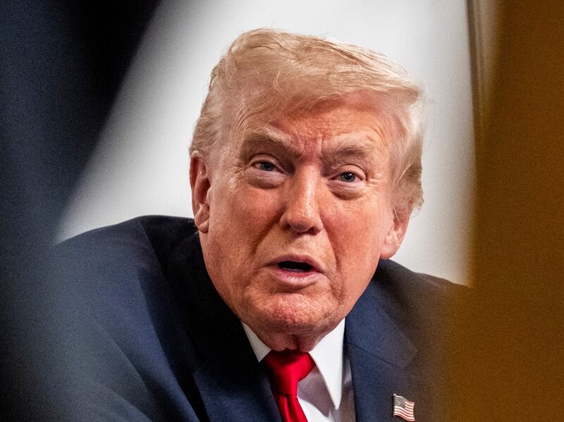 PALM BEACH, FLORIDA - NOVEMBER 27: President Donald Trump participates in a call with U.S. service members from his Mar-a-Lago club in Florida on Thanksgiving Day on November 27, 2025 in Palm Beach, Florida. (Photo by Pete Marovich/Getty Images)