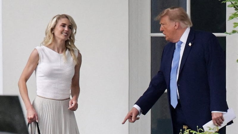 US President Donald Trump and his executive assistant Natalie Harp return from an America.gov AI event to the Oval Office at the White House in Washington, D.C., US, September 29, 2026. REUTERS/Jonathan Ernst
