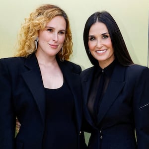 Rumer Willis and Demi Moore pose at the Versace Fall-Winter 2023 collection fashion show in Los Angeles, California, U.S. March 9, 2023.