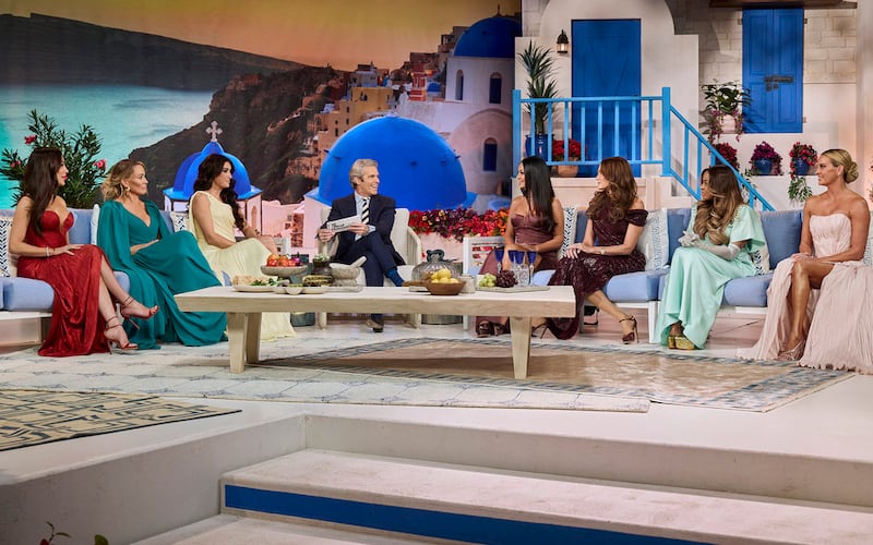 THE REAL HOUSEWIVES OF SALT LAKE CITY -- "Reunion" -- Pictured: (l-r) Angie Katsanevas, Heather Gay, Bronwyn Newport, Andy Cohen, Lisa Barlow, Meredith Marks, Mary Cosby, Whitney Rose -- (Photo by: Clifton Prescod/Bravo)