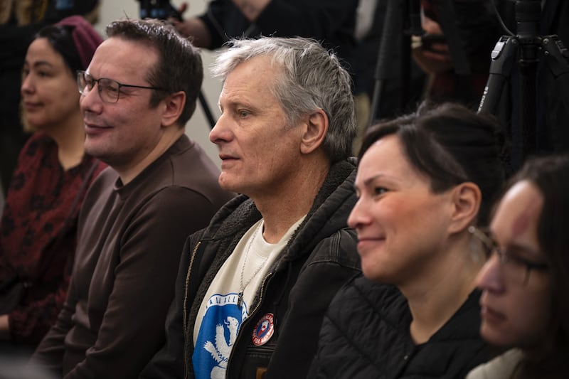 Danish-American actor Viggo Mortensen, wearing a badge reading 'Greenland not for sale', attends a press conference held by a Bipartisan delegation of U.S. senators in Nuuk, Greenland, on February 9, 2026. A delegation of United States senators visited Greenland February 9, 2026 to "rebuild the trust" shattered by President Donald Trump's threats to annex the Arctic island, the lawmakers declared. (Photo by Florent VERGNES / AFP via Getty Images)