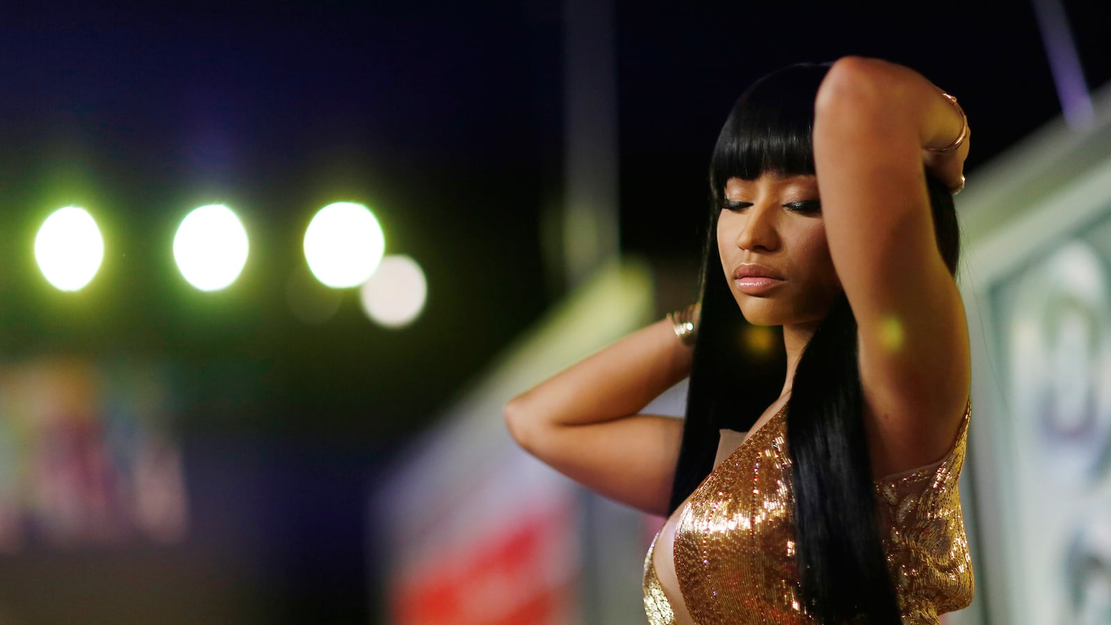 articles/2015/11/26/nicki-minaj-s-racist-media-coverage/151125-zimmerman-minaj-tease_x9mnp9