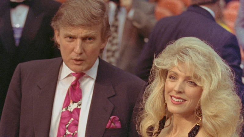 Donald Trump and MArla Maples arrive at ringside for the start ofthe Evander Holfield and George Formena title fight.  April 19, 1991 REUTERS/Gary Hershorn 91176085  ATLANTIC CITY BOXING COUPLE HEAVYWEIGHT SMILING WAIST UP WOMAN; Trump, Donald; Maples, Marla  Donald Trump MArla Maples  DISCLAIMER: The image is presented in its original, uncropped, and untoned state. Due to the age and historical nature of the image, we recommend verifying all associated metadata, which was transferred from the index stored by the Bettmann Archives, and may be truncated.
