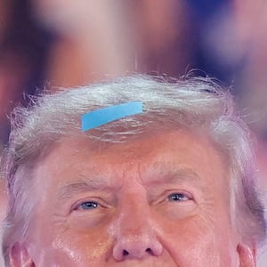 U.S. President Donald Trump, with a piece of confetti in his hair, attends the 2026 Patriot Games final at SPIRE Academy in Geneva, Ohio, U.S., August 11, 2026. REUTERS/Kylie Cooper