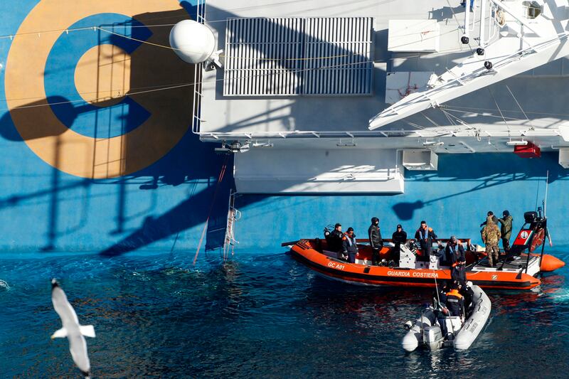 articles/2012/01/26/costa-concordia-legal-battle-gets-ugly/concordia-cruise-ship-sinking-update-scapegoat-barbie_j61cme