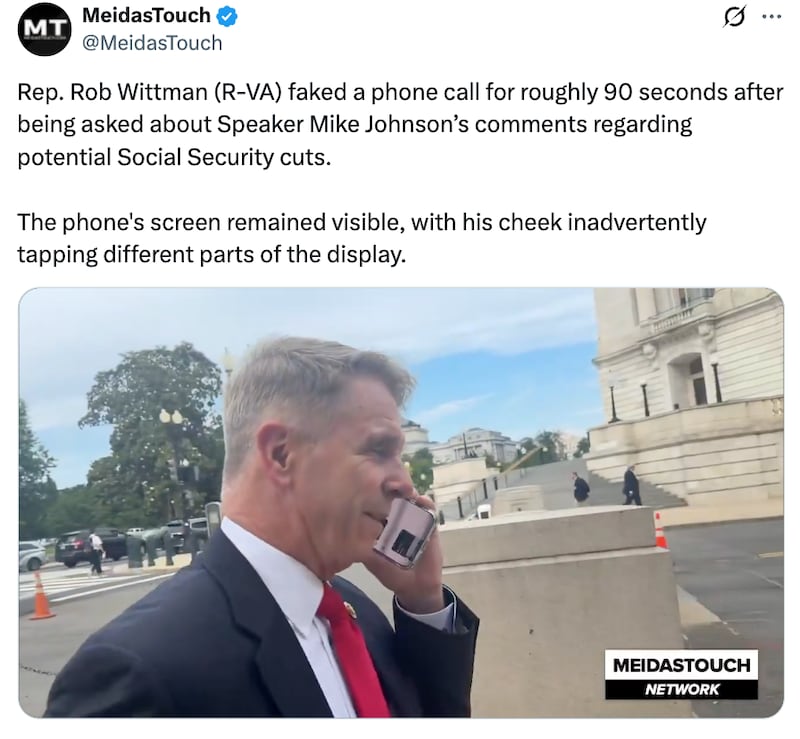 Rob Wittman faking a phone call when questioned by a MeidasTouch reporter