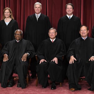 Justices of the US Supreme Court pose for their official photo at the Supreme Court in Washington, DC on October 7, 2022. (Seated from left) Associate Justice Sonia Sotomayor, Associate Justice Clarence Thomas, Chief Justice John Roberts, Associate Justice Samuel Alito and Associate Justice Elena Kagan, (Standing behind from left) Associate Justice Amy Coney Barrett, Associate Justice Neil Gorsuch, Associate Justice Brett Kavanaugh and Associate Justice Ketanji Brown Jackson. (Photo by OLIVIER DOULIERY / AFP) (Photo by OLIVIER DOULIERY/AFP via Getty Images)