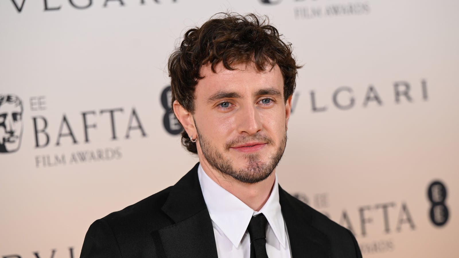 A photo of Paul Mescal on a red carpet