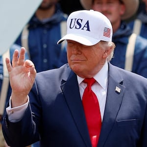 U.S. President Donald Trump gestures as he arrives to speak at Burning Hills Amphitheatre on the day of the dedication of the Theodore Roosevelt Presidential Library in Medora, North Dakota, U.S., July 1, 2026.