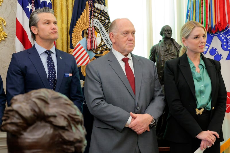 Defense Secretary Pete Hegseth stands with White House Border Czar Tom Homan, and Attorney General Pam Bondi before former U.S. Sen. Markwayne Mullin is sworn in as the next secretary of the Department of Homeland Security in the Oval Office at the White House on March 24, 2026.