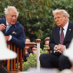 U.S. President Donald Trump speaks with Britain's King Charles as they take part in the Beating the Retreat ceremony during their state visit, at Windsor Castle, in Windsor, Britain, September 17, 2025. REUTERS/Kevin Lamarque