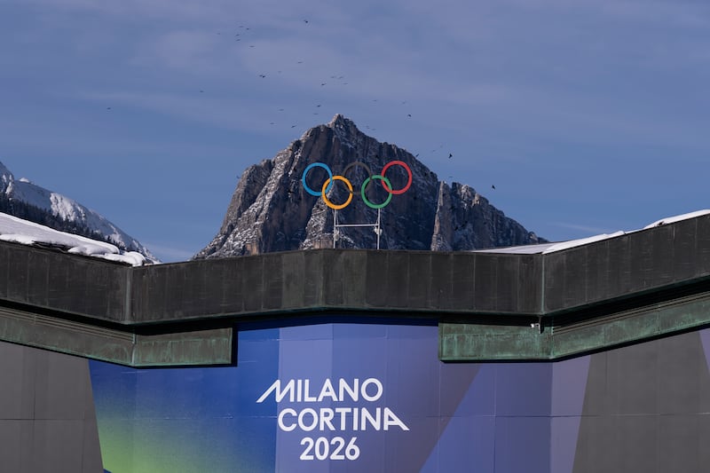 The Olympic Rings are set in front of surrounding mountains at Cortina Curling Olympic Stadium on January 26, 2026 in Cortina d'Ampezzo, Italy.