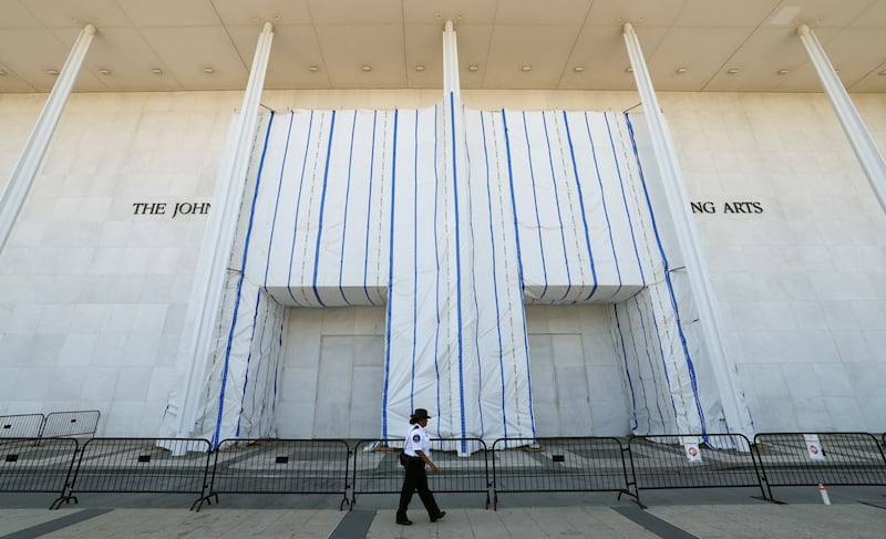 A guard patrols the front of the John F. Kennedy Center for the Performing Arts on the day of a vote by the board to shut down the center for repairs, which means the building will close immediately, in Washington, D.C., on September 15, 2026.