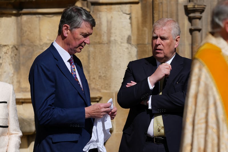 Timothy Lawrence, husband of Britain's Princess Anne, speaks to Prince Andrew, Duke of York, as they arrive for the Easter Matins Service at St. George's Chapel, Windsor Castle, in Windsor, Britain, April 20, 2025. Kirsty Wigglesworth/Pool via REUTERS
