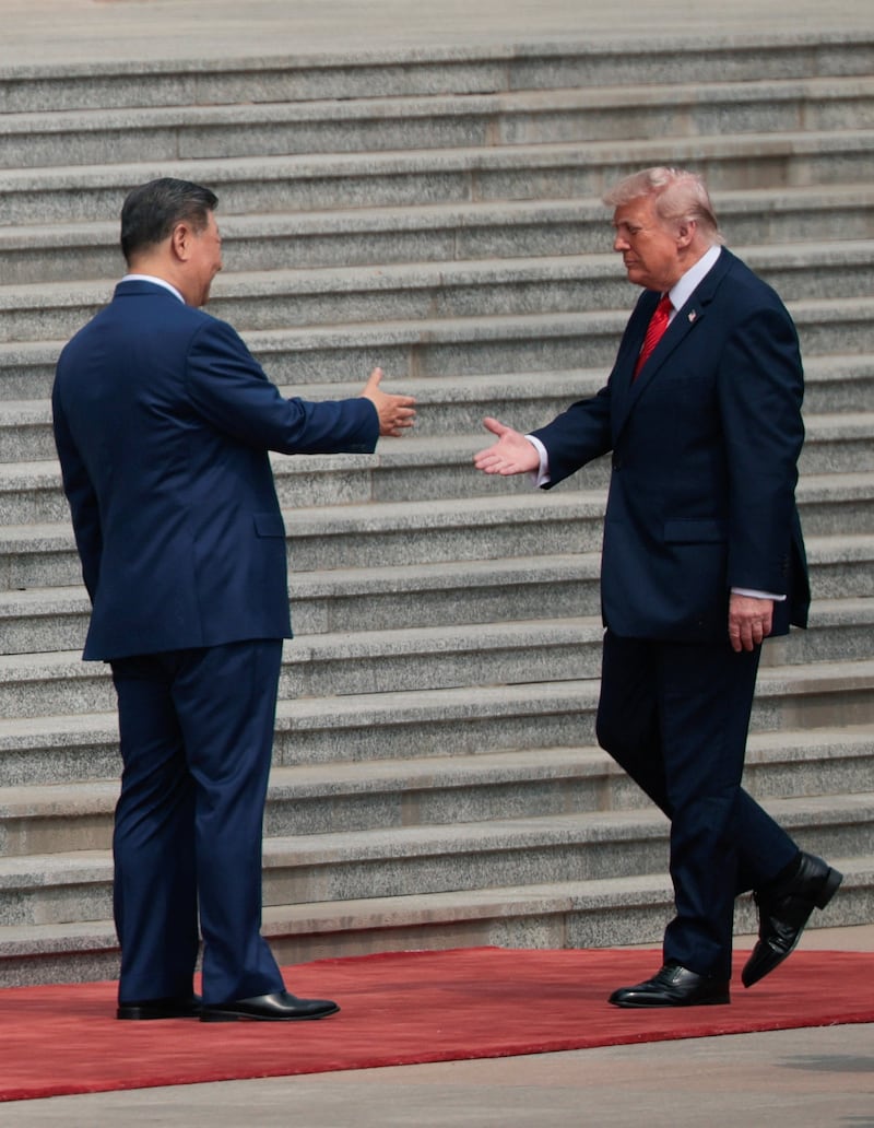 Trump and Xi handshake.