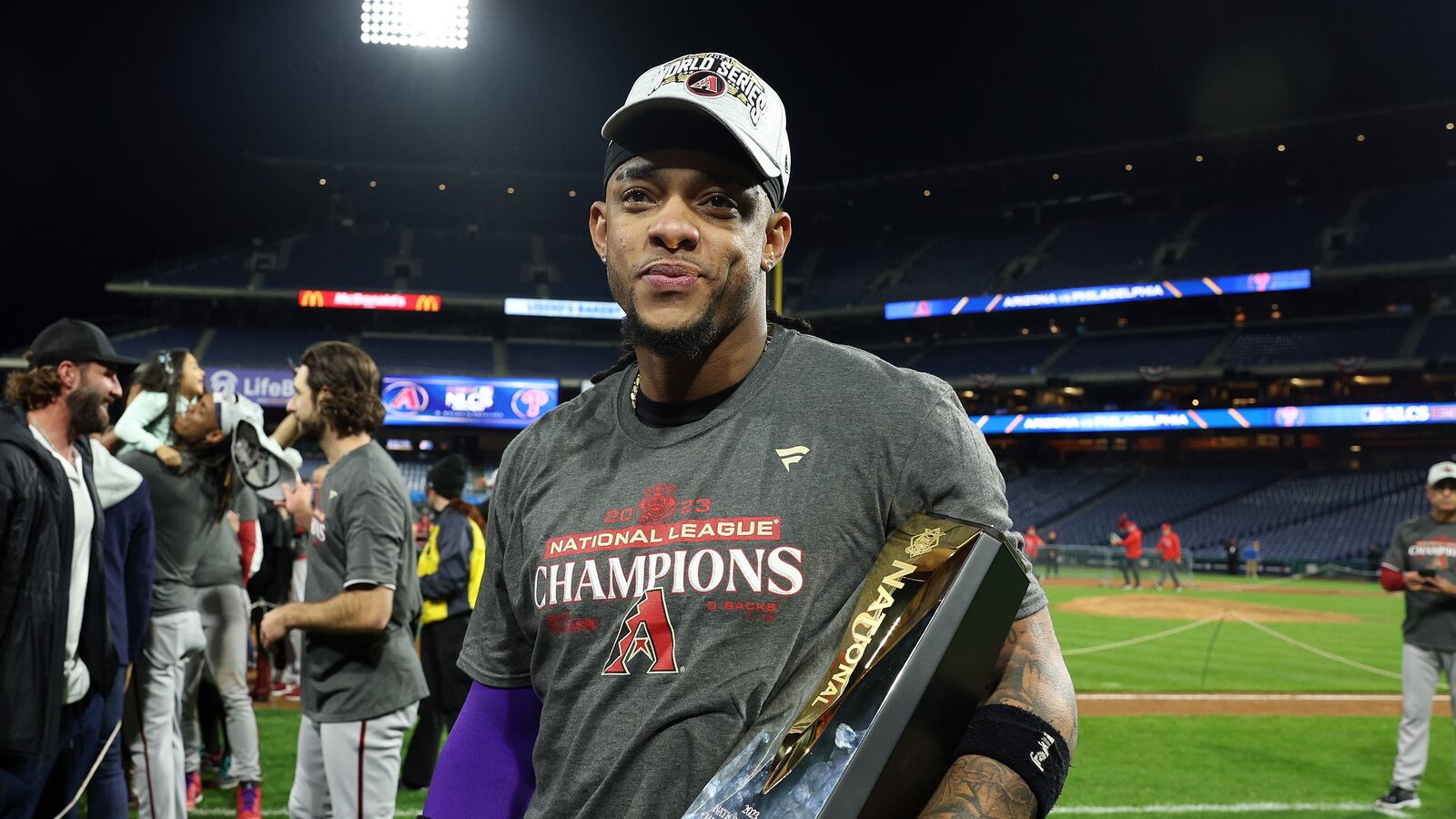 Marte with NL pennant trophy in 2023.