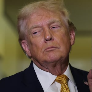 U.S. President Donald Trump (R) and U.S. Sen. Lindsey Graham (R-SC) speak to the media aboard Air Force One enroute to Washington, DC on January 04, 2026.