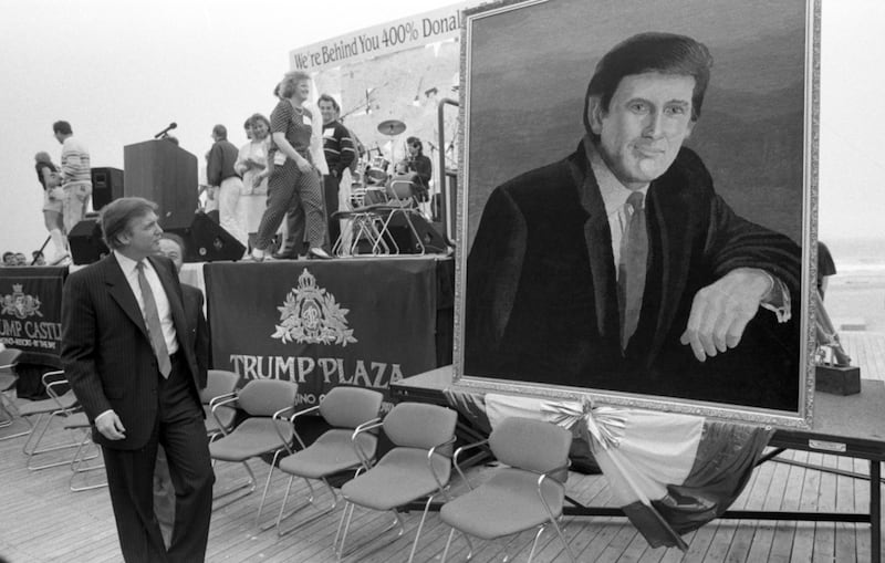 Donald Trump Looks at portrait during birthday party in his honor in Atlantic City, NJ on June 26, 1990.