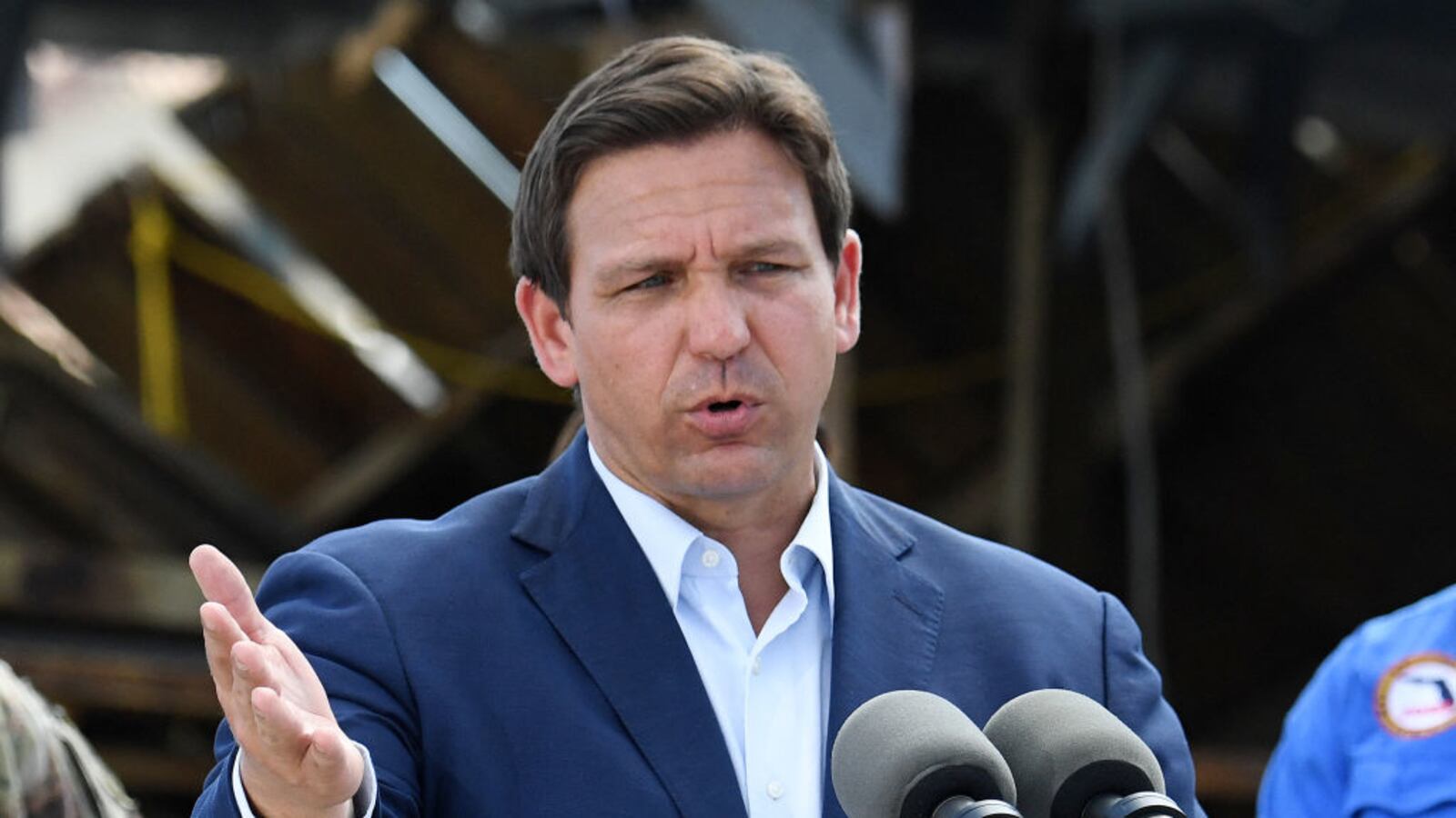 Florida Governor Ron DeSantis speaks to a neighborhood impacted by Hurricane Ian at Fisherman's Wharf in Fort Myers, Florida.