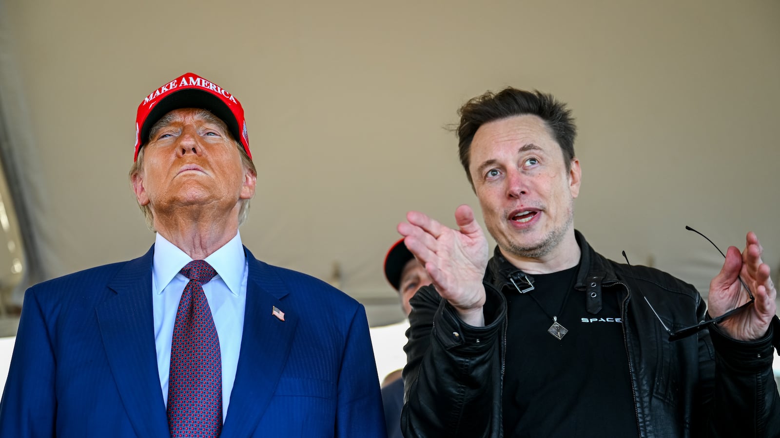 Elon Musk speaks with U.S. President-elect Donald Trump as they watch the launch of the sixth test flight of the SpaceX Starship rocket on November 19, 2024 in Brownsville, Texas.