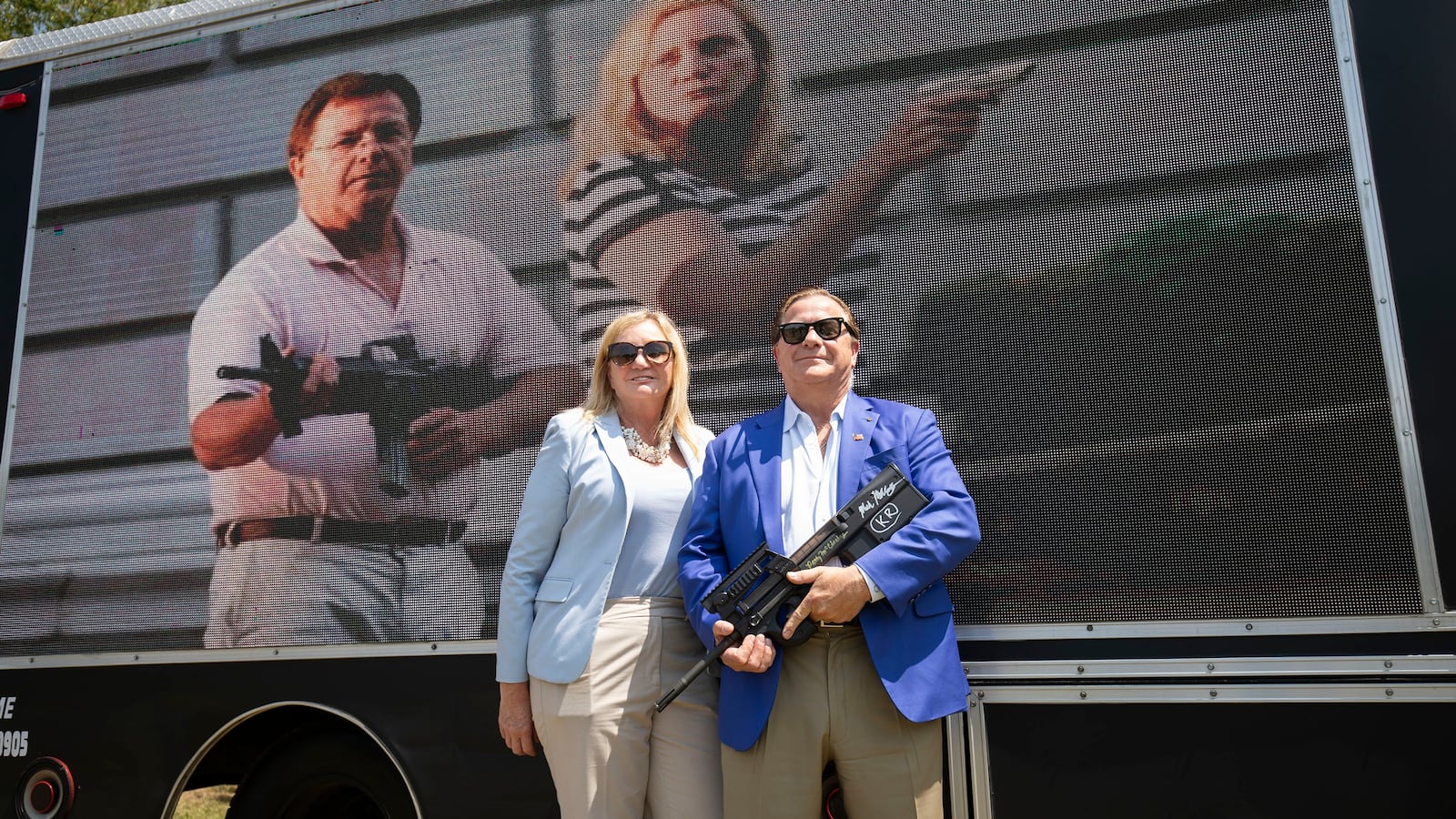 Mark and Patricia McCloskey of St. Louis, Missouri pose for a photo before speaking at a "Defend Our 2A: Michigan's Fight for Self Preservation" rally at a farm on July 19, 2023 in Ionia, Michigan.